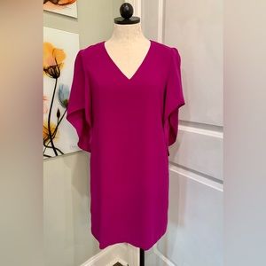 Anna Cate Meredith Dress in a fuschia or magenta color.